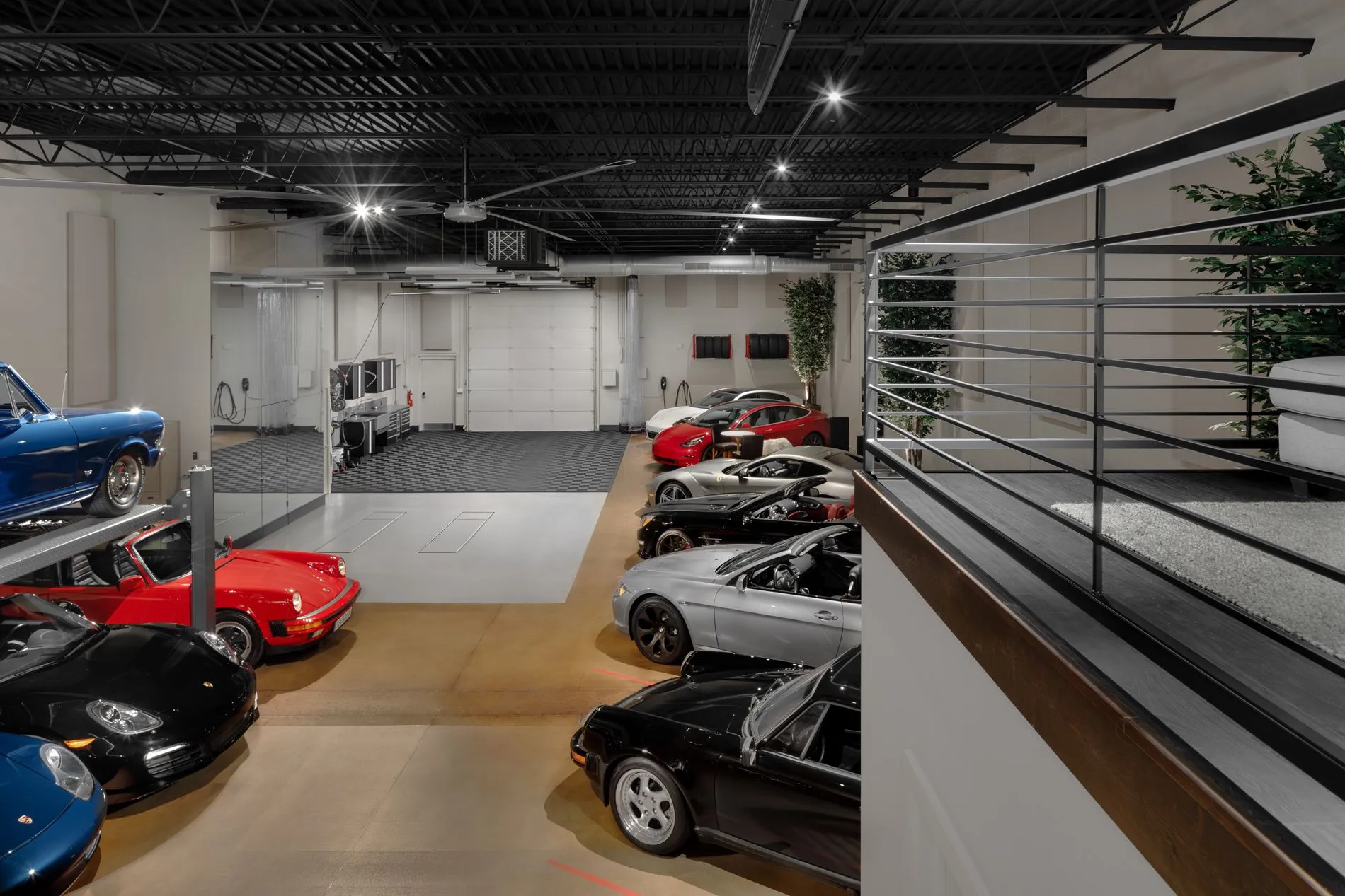 Climate-controlled private car club storage showroom with classic and modern sports cars